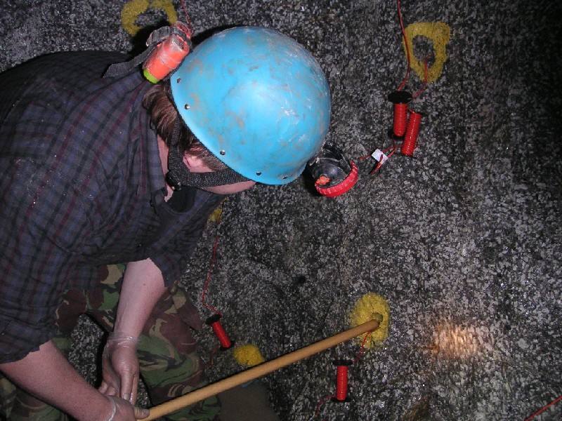 charles loading hole2.JPG - Pushing the gelignite down the charge hole.